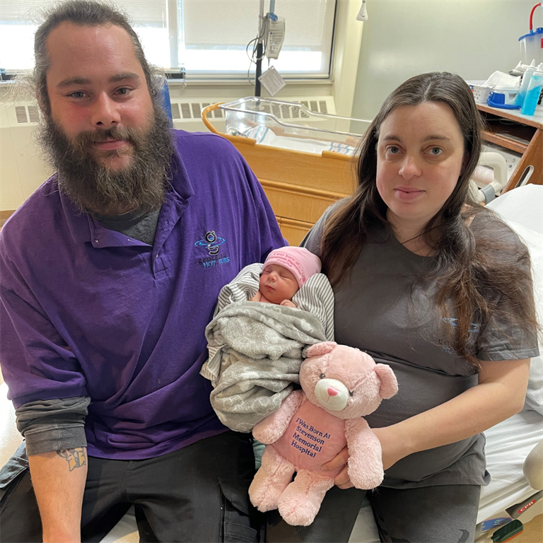 Parents Sara Wright and Corey Offen with their newborn daughter Alice